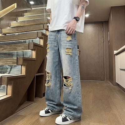 Light colored ripped jeans for men